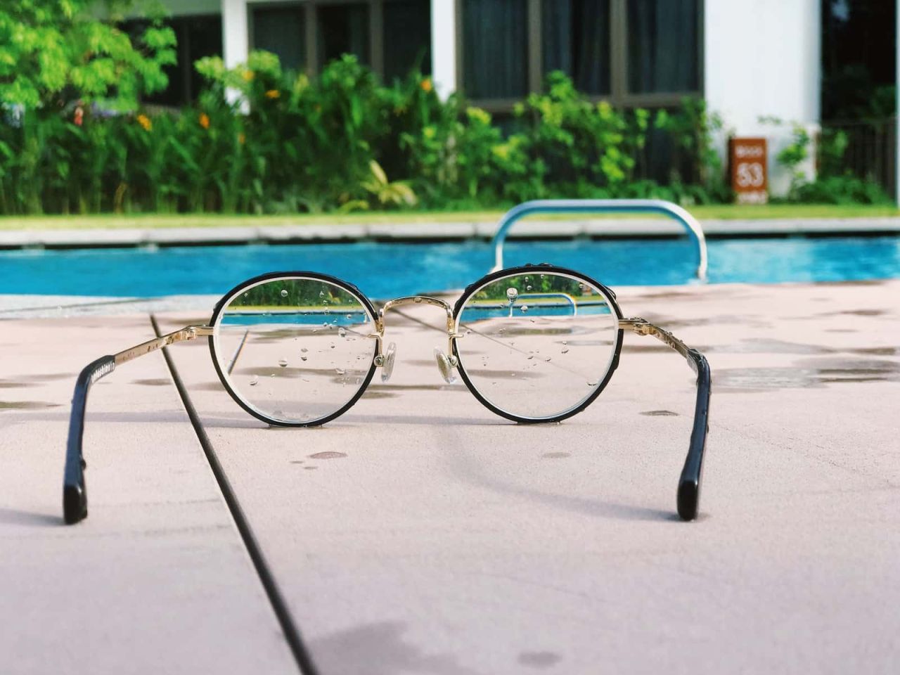 eyeglasses with black frames on white fabric